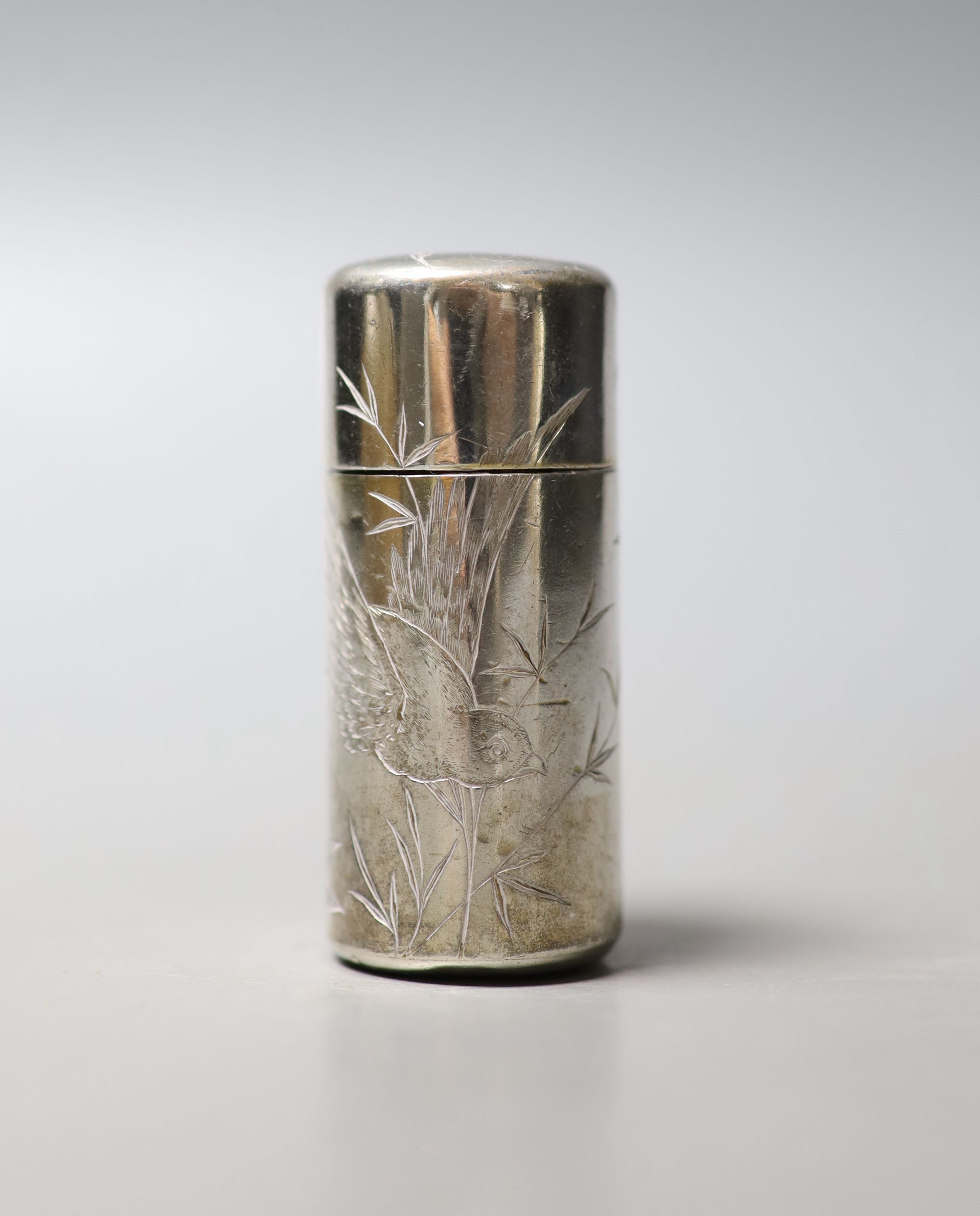 A Victorian silver cylindrical scent bottle, with aesthetic engraved decoration, Hall & Goode, London, 1886, 59mm.